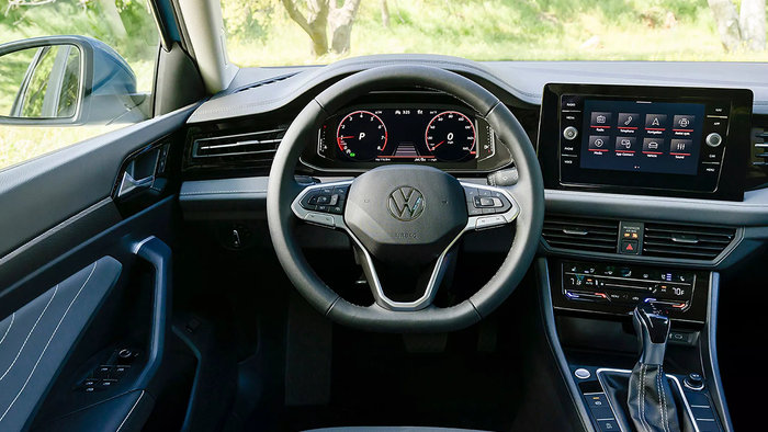 Interior view of Volkswagen Jetta dashboard and steering wheel.